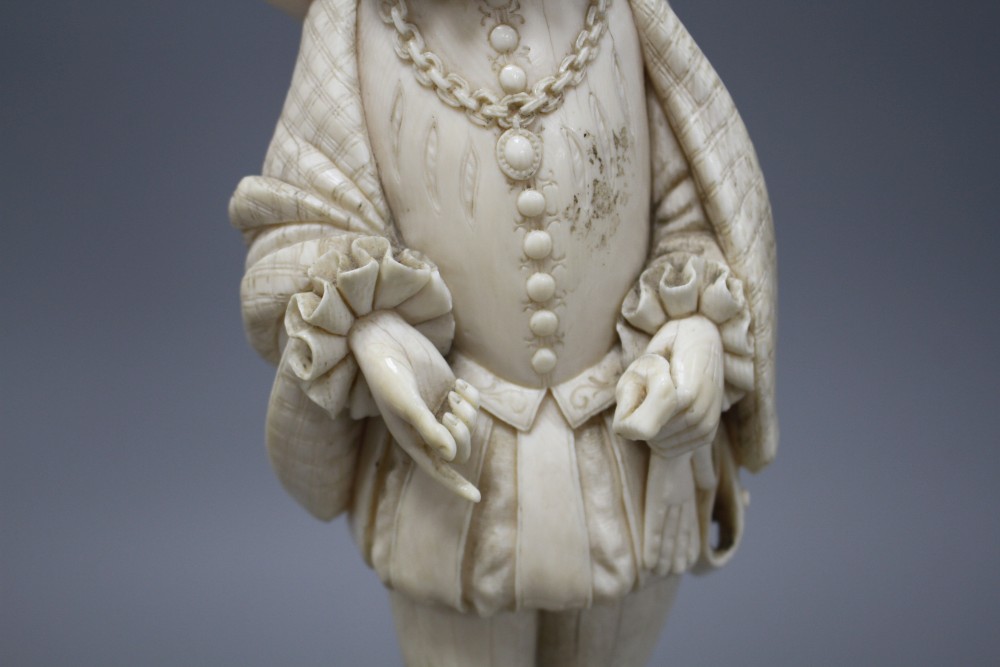 A 19th century Dieppe carved ivory figure of a 17th century gentleman, standing and wearing a ruff colour, height 30cm,